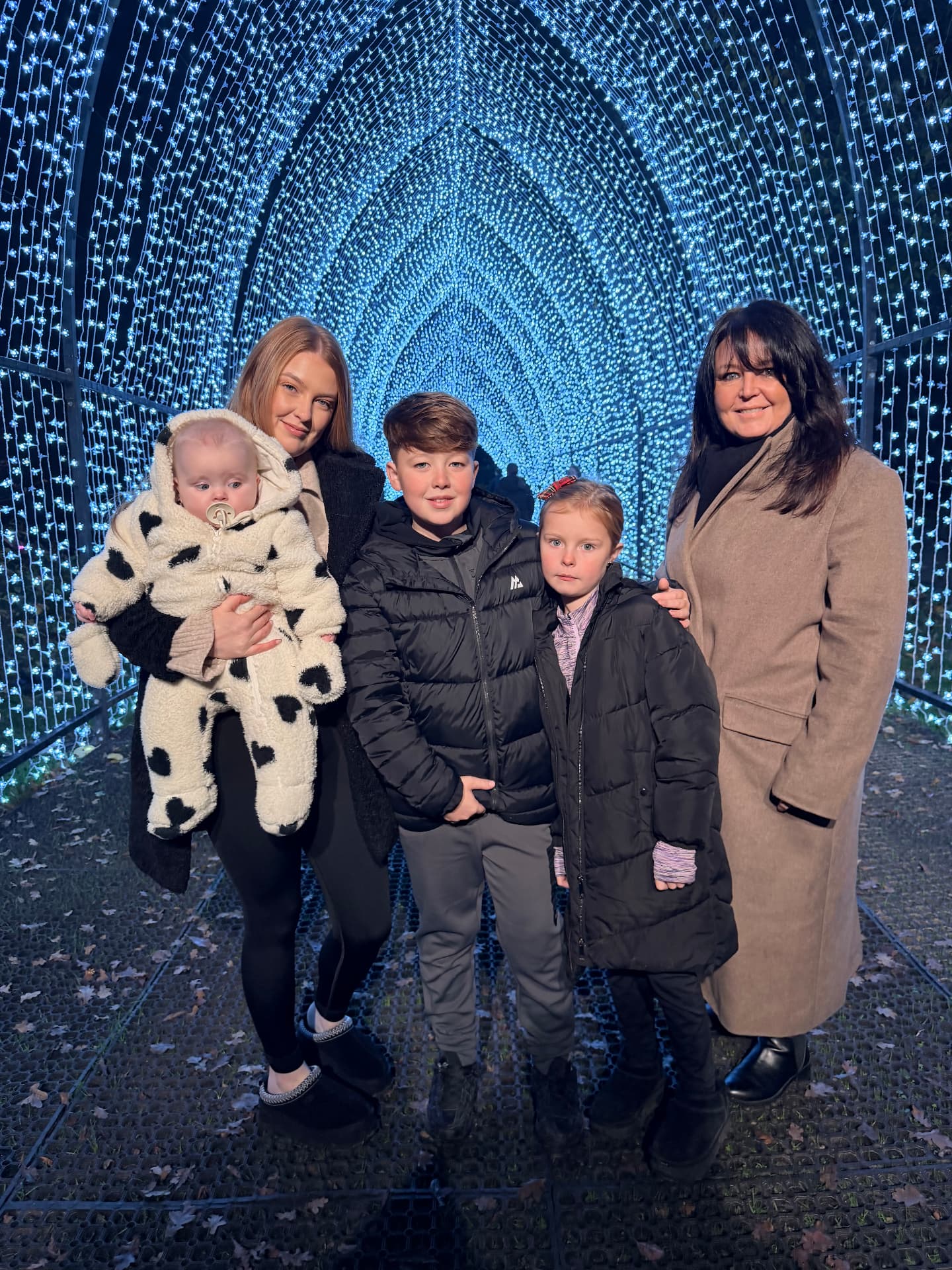Emmalee and her family enjoying a festive lights experience